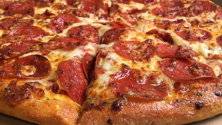 A closeup of a meaty pizza 