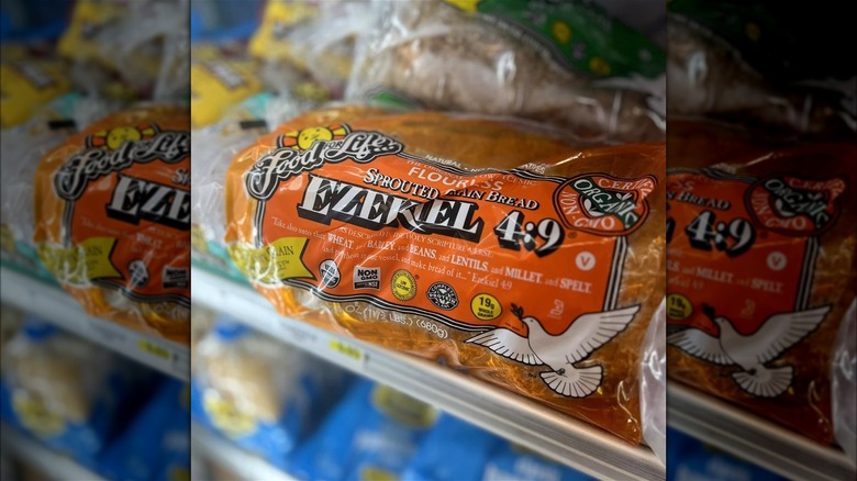 A loaf of flourless Ezekiel 4:9 sprouted grain bread on a supermarket shelf.