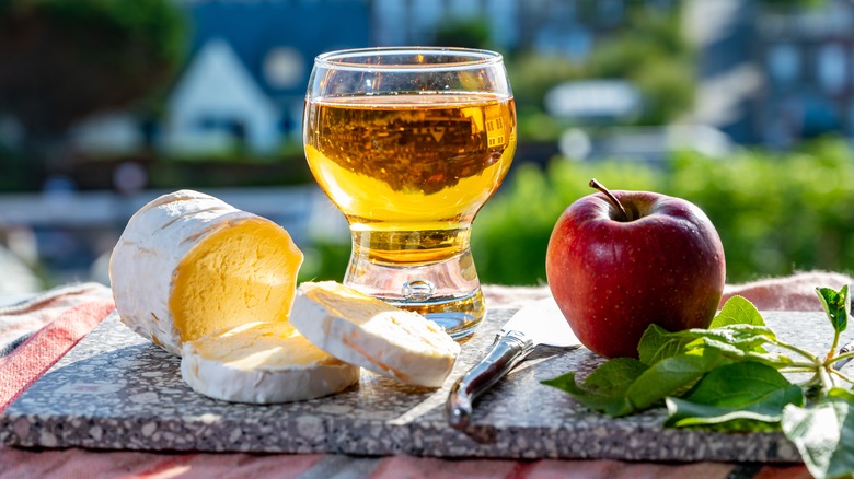 Apple next to Neufchâtel and a beer