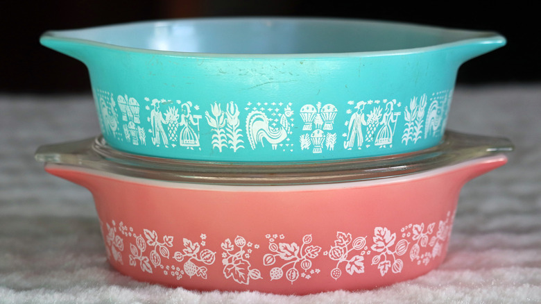 Two round casserole Pyrex dishes are stacked on top of each other