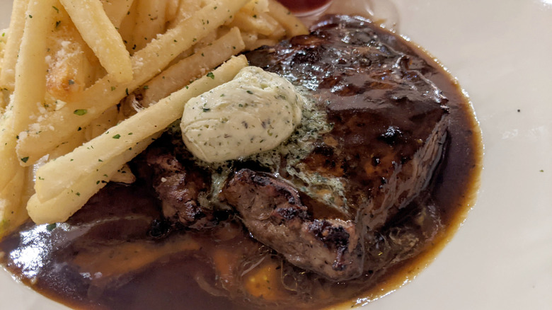 Steak and fries with butter