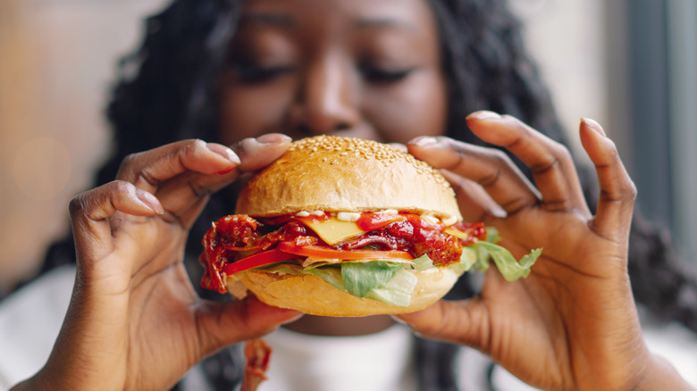 Woman eating burger