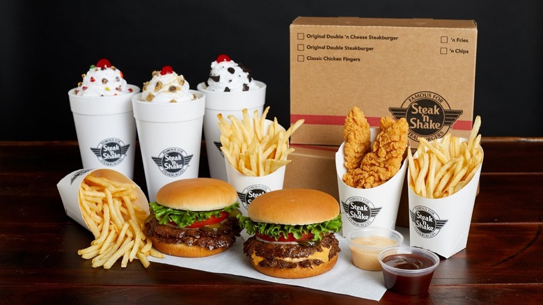 Steak 'n Shake burgers, fries, and shakes on a tray