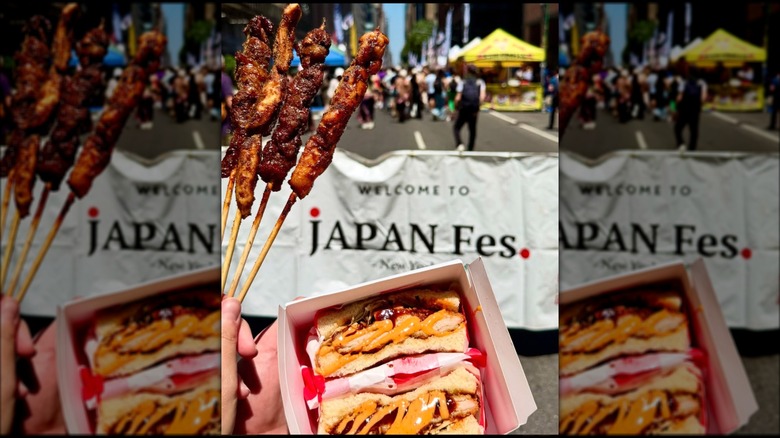Hands holding chicken skewers and sandwiches at Japan Fes