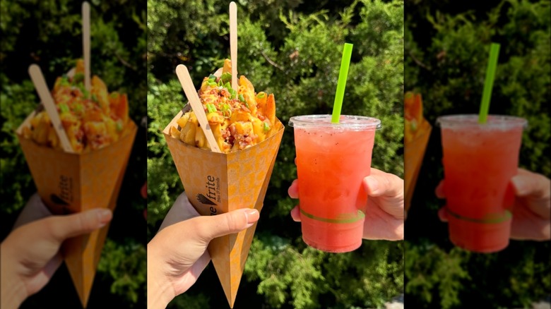 Hands holding fries and juice at Smorgasburg
