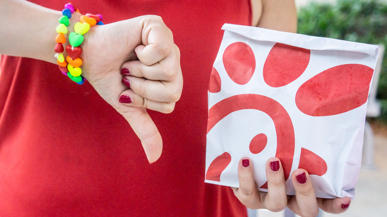 Person giving Chick-fil-A a thumbs-down