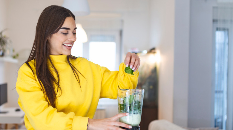 Person making a smoothie