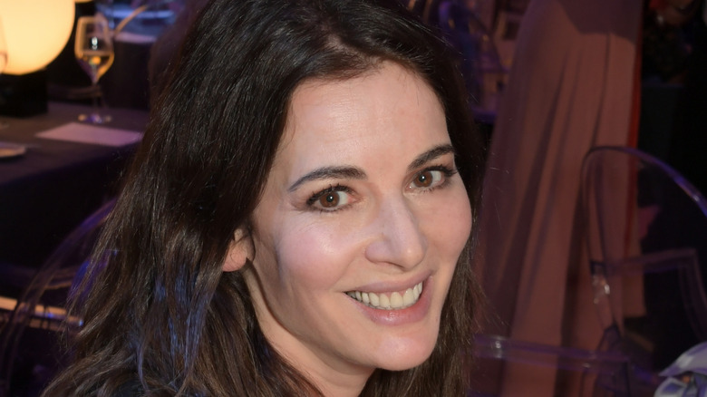 Nigella Lawson smiling at table