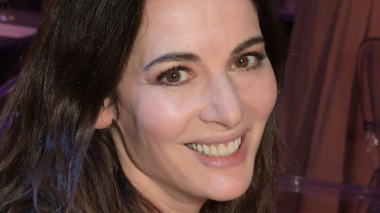 Nigella Lawson smiling at table