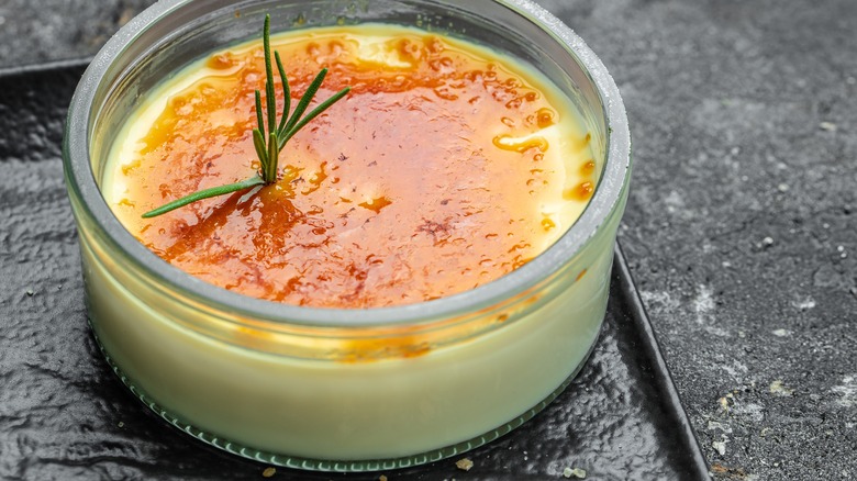 Crème brulée with rosemary sprig