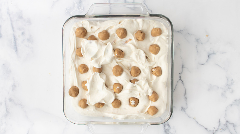 ice cream and cookie dough balls in glass dish