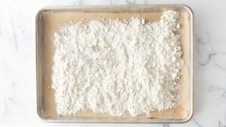 flour spread on baking sheet