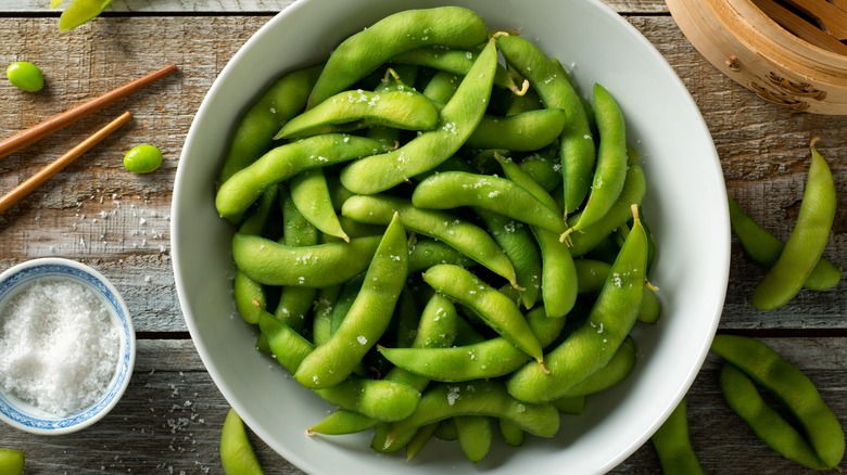 Salted edamame in white bowl