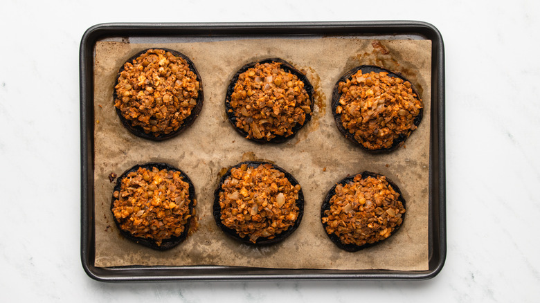 Vegan stuffed mushrooms on baking sheet