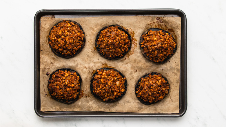 Vegan stuffed mushrooms on baking sheet