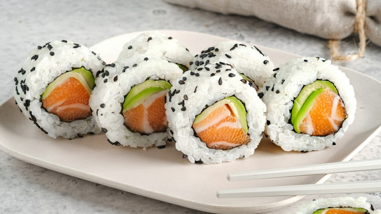Sliced sushi roll on plate