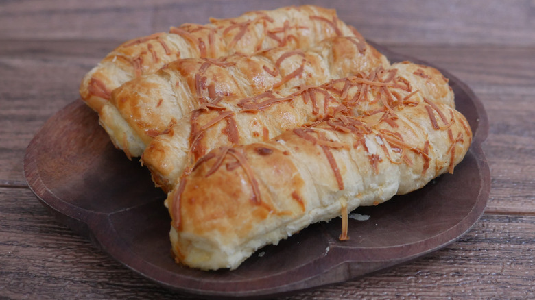 Cheese stuffed bread sticks on plate