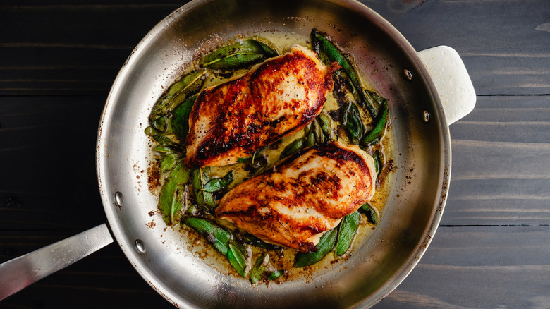 Two chicken breasts in pan