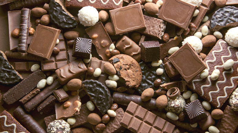 assortment of chocolate candy, cookies, and other treats