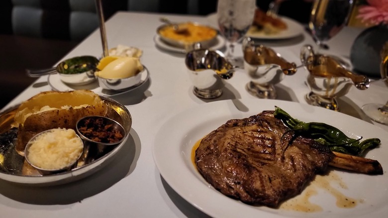 Prime Steakhouse steaks and sides on table