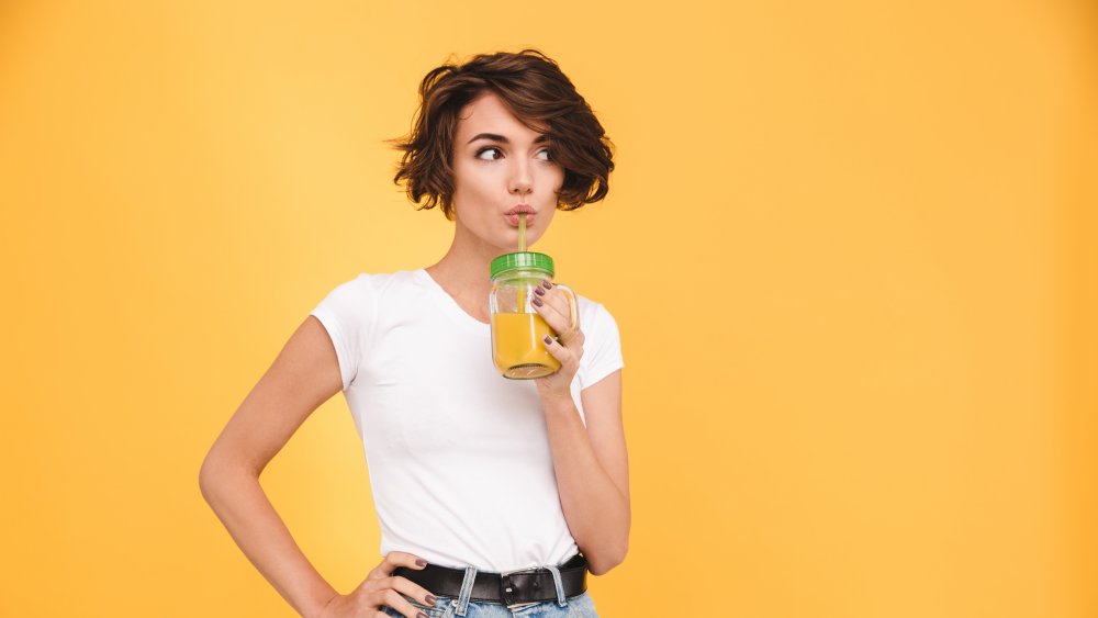 Woman drinking juice