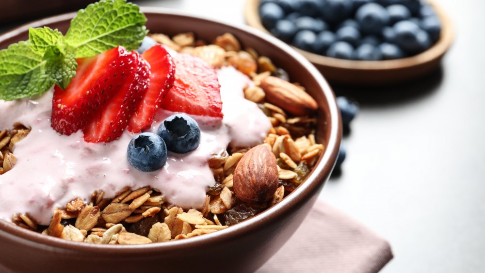 breakfast cereal in a bowl with fruit and yogurt 