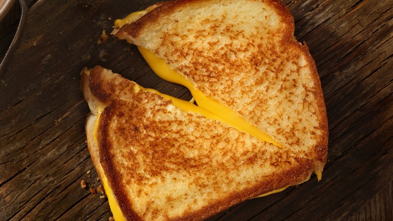 Grilled cheese sandwich cut in half diagonally 
