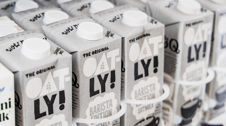 Rows of Oatly Barista Edition oat milk at the grocery store.