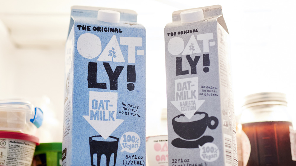 Carton of Oatly's on a fridge self