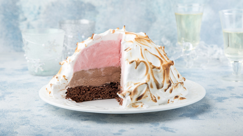 Cut open Baked Alaska with chocolate and strawberry ice cream