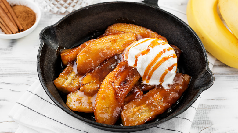 Homemade bananas foster in pan with ice cream