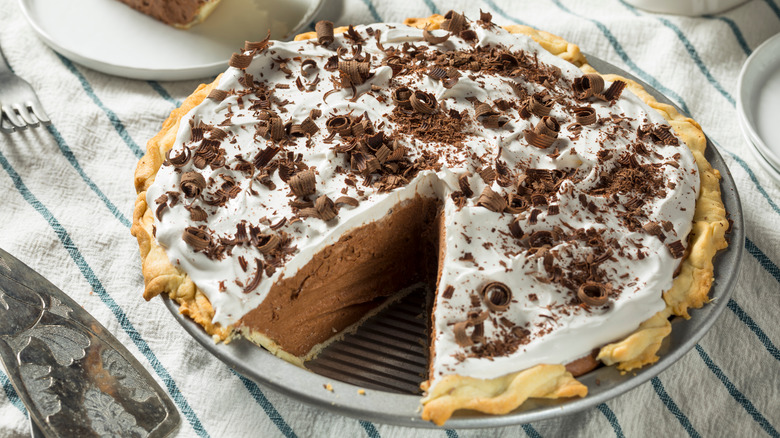 Chocolate chiffon pie with slice missing