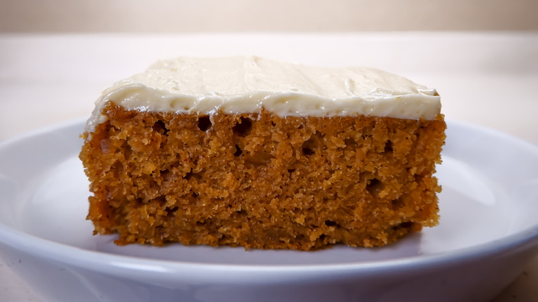 Slice of spice cake with cream cheese frosting