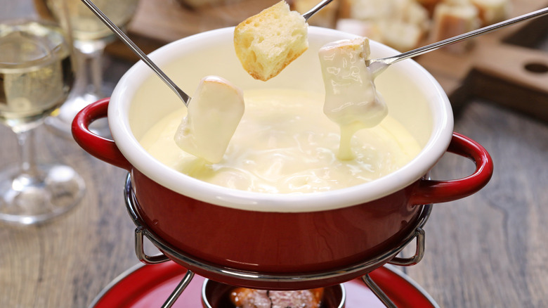 traditional cheese fondue in a fondue set