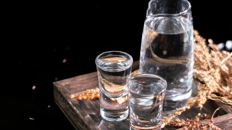 pitcher and glasses of grain alcohol