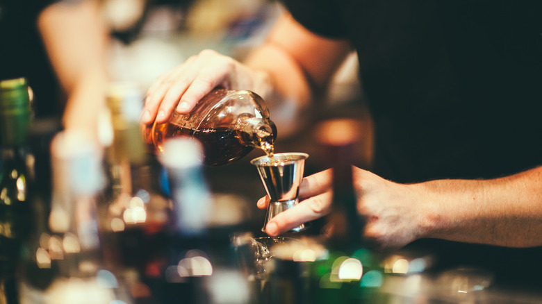 bartender pouring a shot