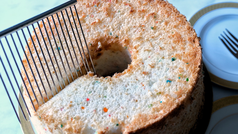 Cake breaker tool cutting an angel food cake