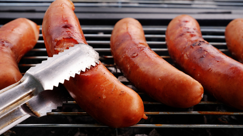 Sausages cooking on a grill