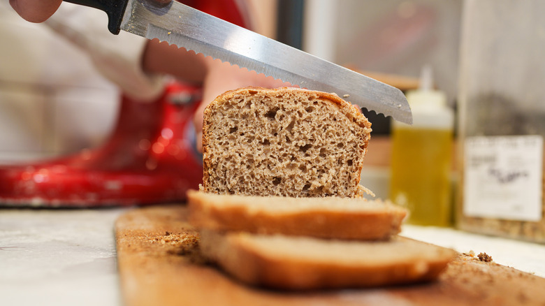 loaf of bread being sliced