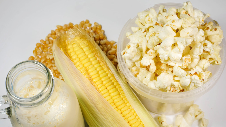 Milk jug, ear of corn, and popcorn