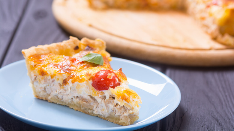 Slice of quiche on plate