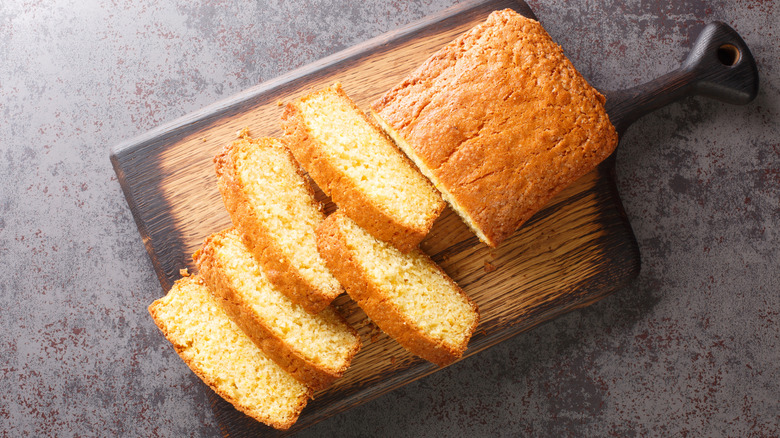 sliced Madeira cake on wooden board