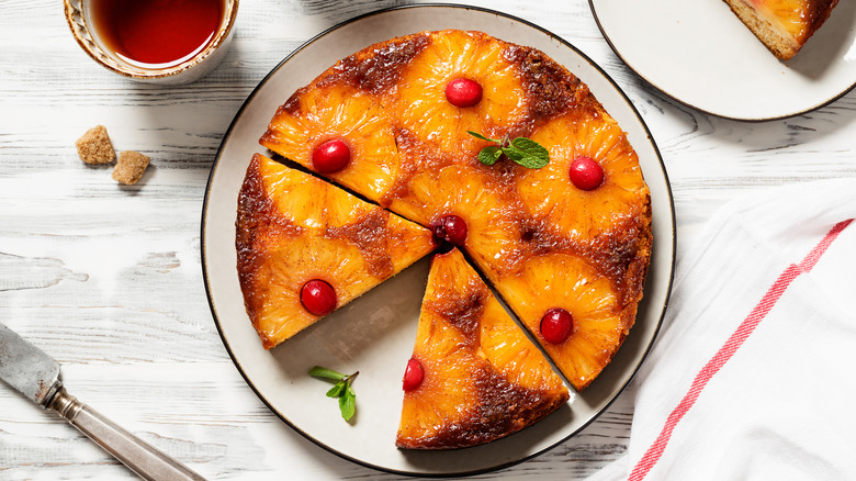 pineapple upside down cake with knife and tea