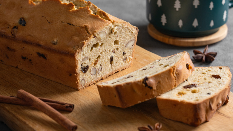 spiced fruit loaf with spices on wooden board