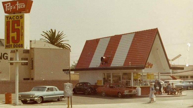 Exterior of Pup 'n' Taco restaurant with palm tree