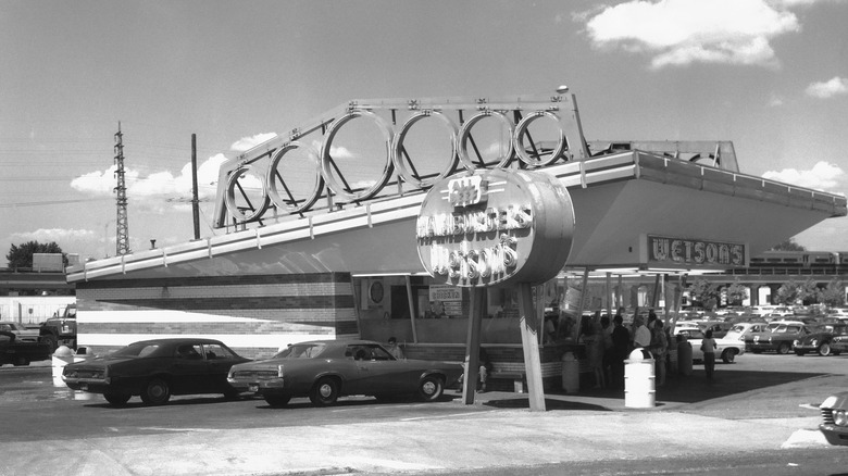 Exterior of Wetson's Hamburgers with old-fashioned cars