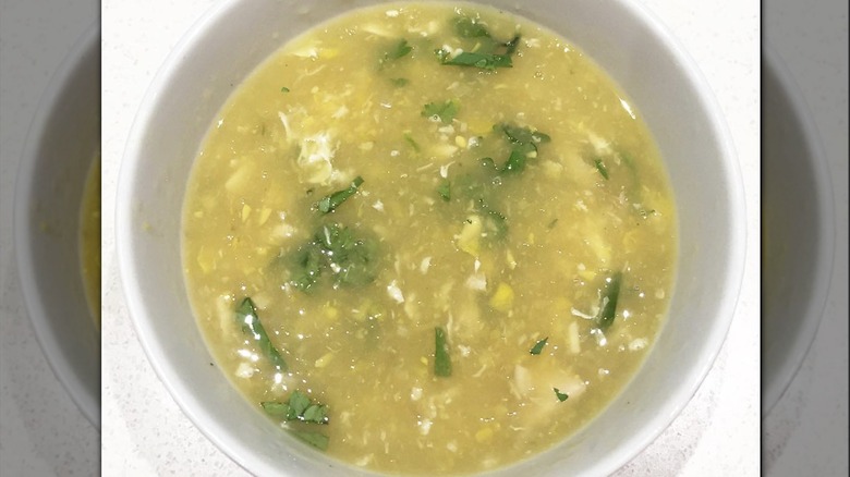 Overhead shot of chicken and corn soup in bowl
