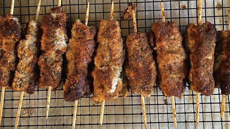 Skewers of city chicken on drying rack