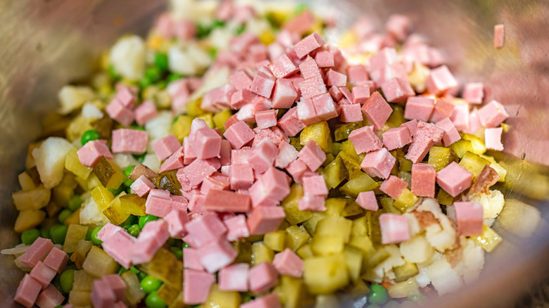 cubed bologna mixed with pickles and peas