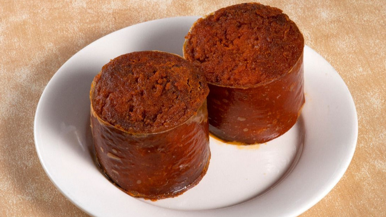 sliced kishka on a white plate